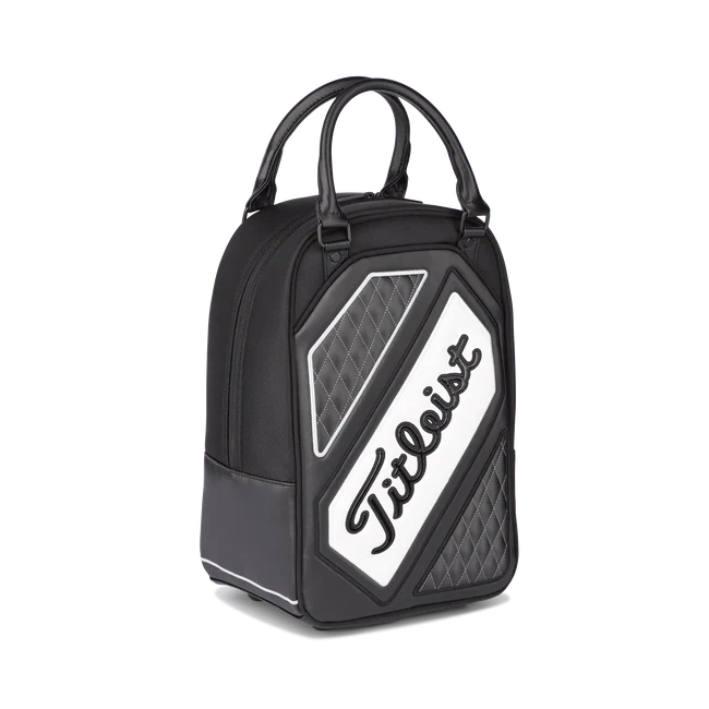 Titleist shag bag in black, grey and white with poly-urethane handles and the the word Titleist angled across it.