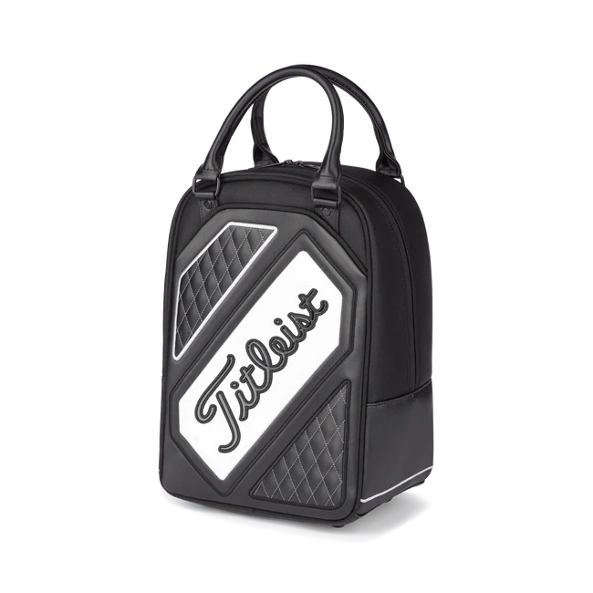 Titleist shag bag in black, grey and white with poly-urethane handles and the the word Titleist angled across it.