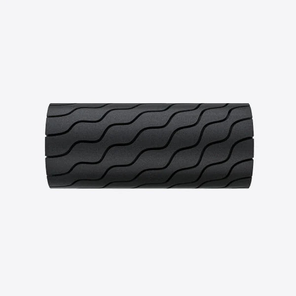 Black Theragun Wave Roller vibrating massage foam roller with wave pattern against a white background.